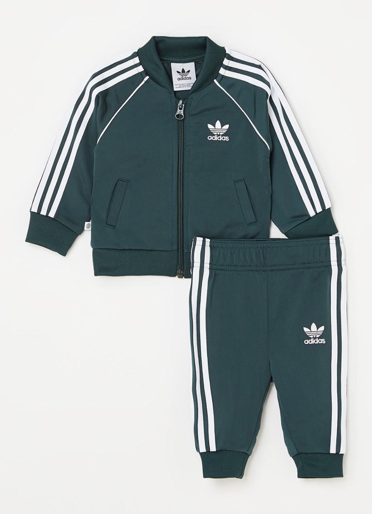 Naleving van Sympton Vereniging adidas Superstar trainingspak met logo 2-delig • Groen • deBijenkorf.be