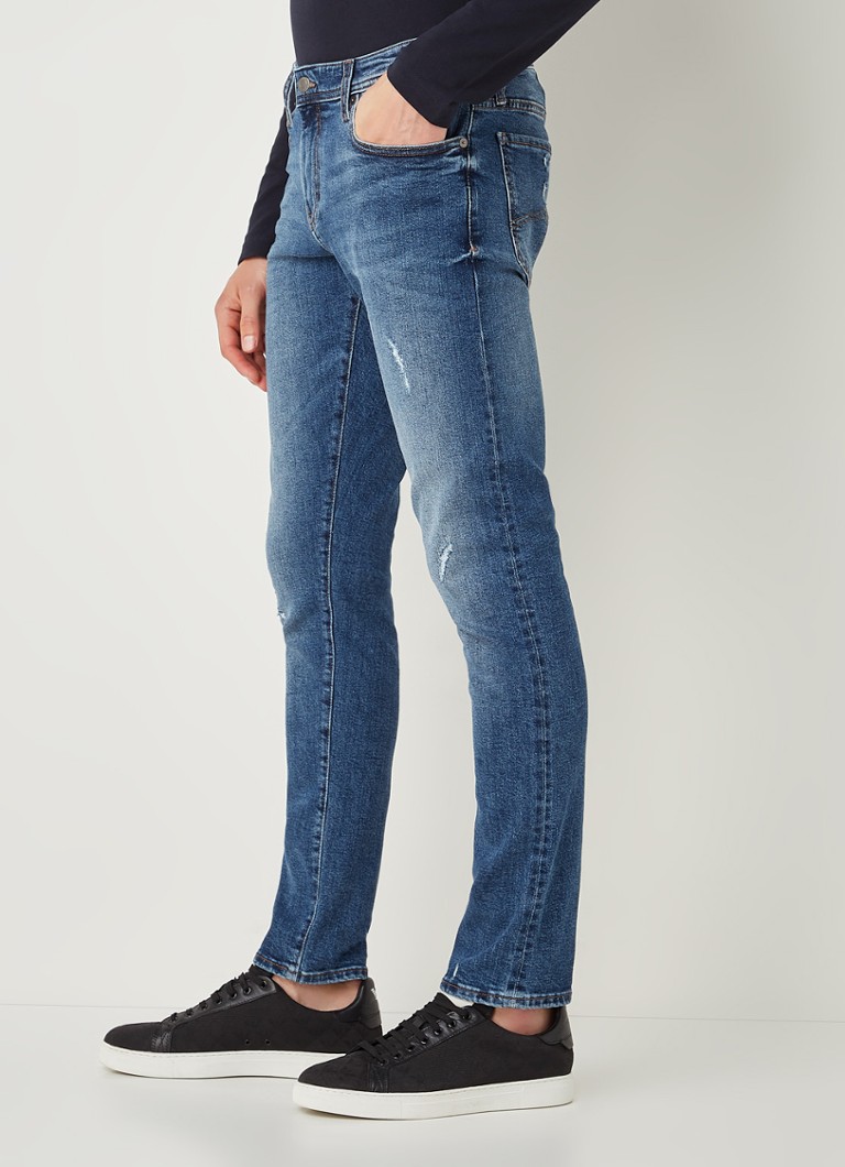 Armani Exchange J14 skinny jeans met medium wassing en ripped details •  Indigo • 