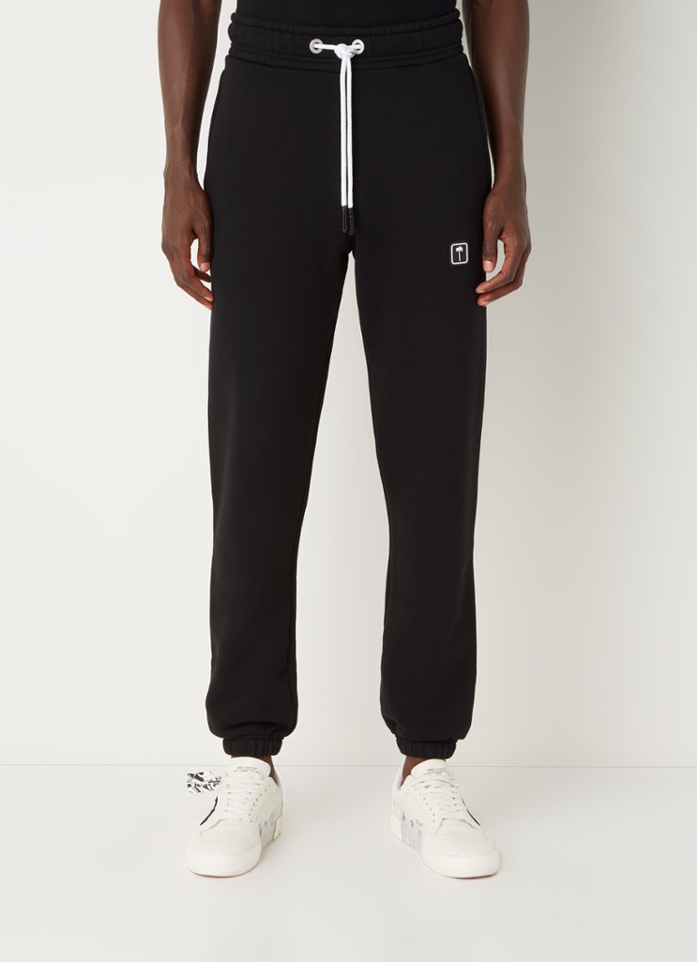 Palm Angels - Tapered fit joggingbroek met steekzakken en logo - Zwart