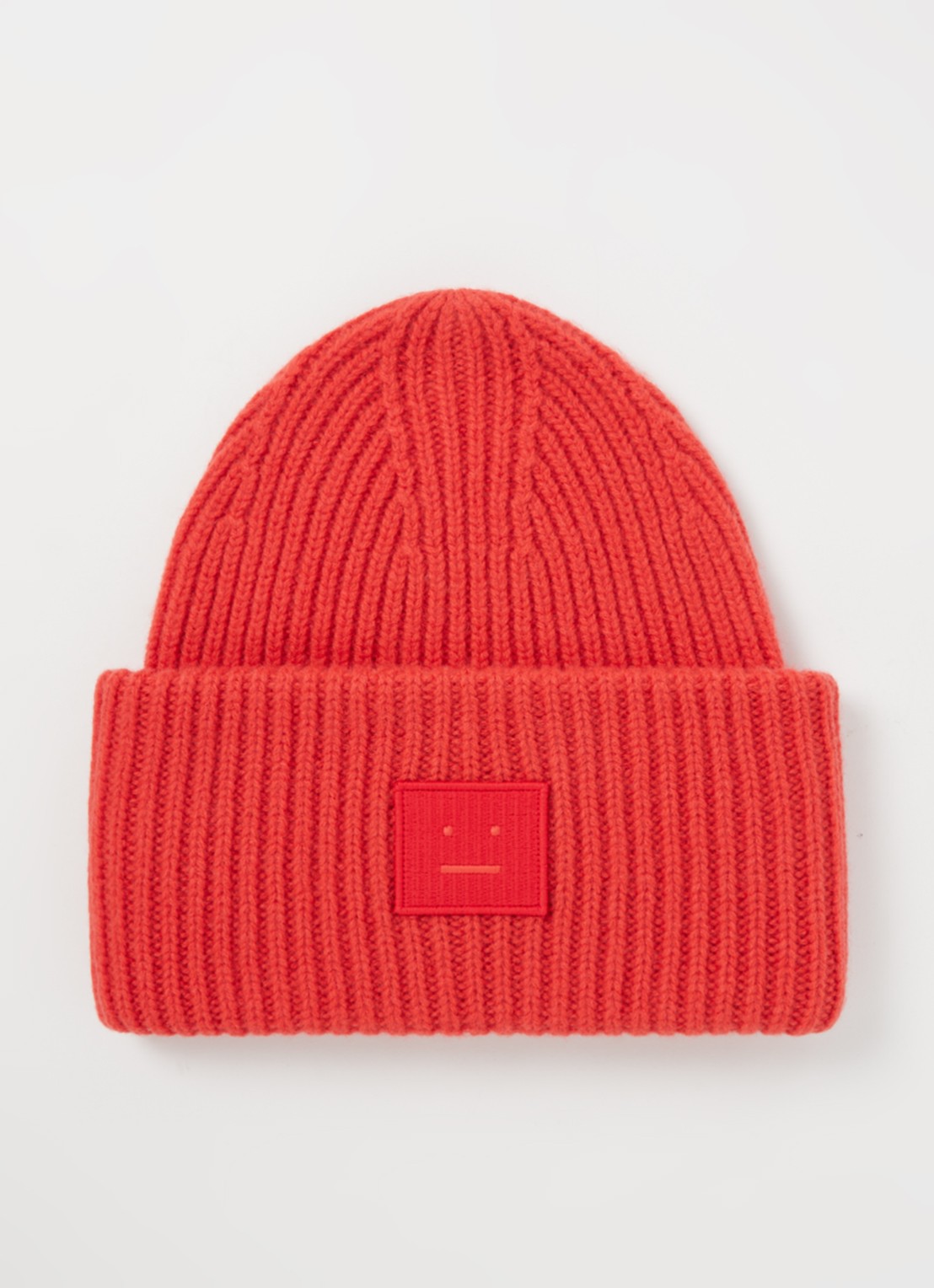 Acne Studios Fijngebreide muts van wol met logo - voorkant steenrood