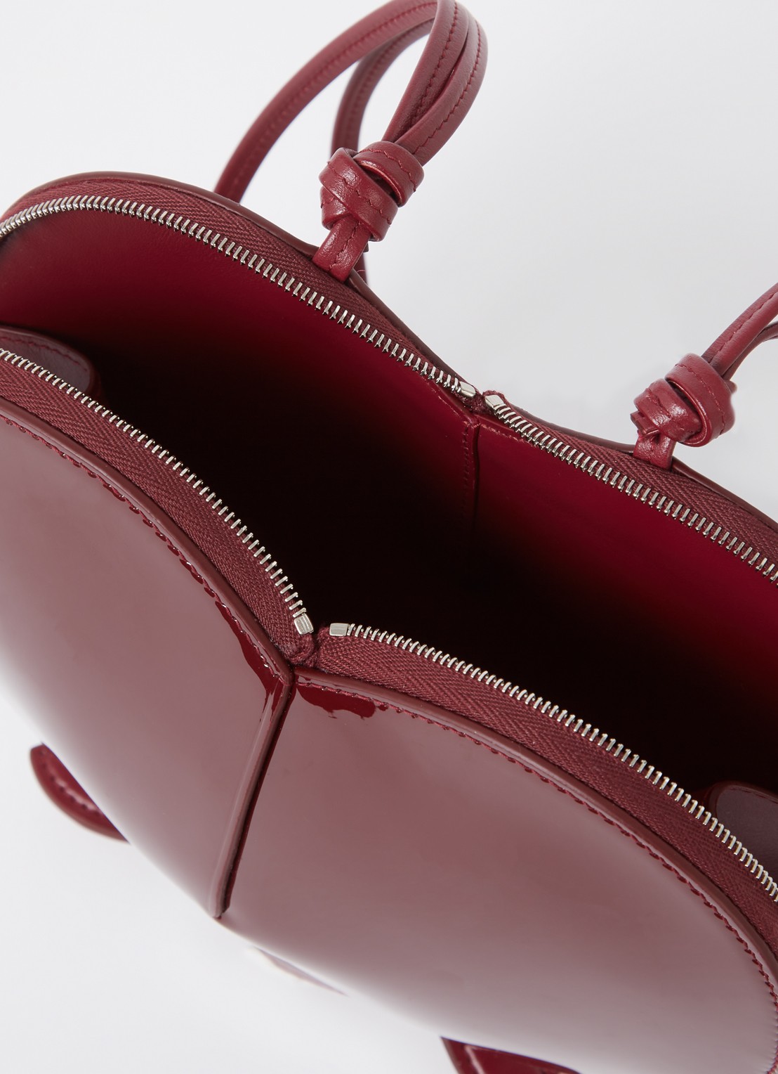 Alaïa Le Coeur crossbodytas van kalfsleer  - detail 2 bordeauxrood