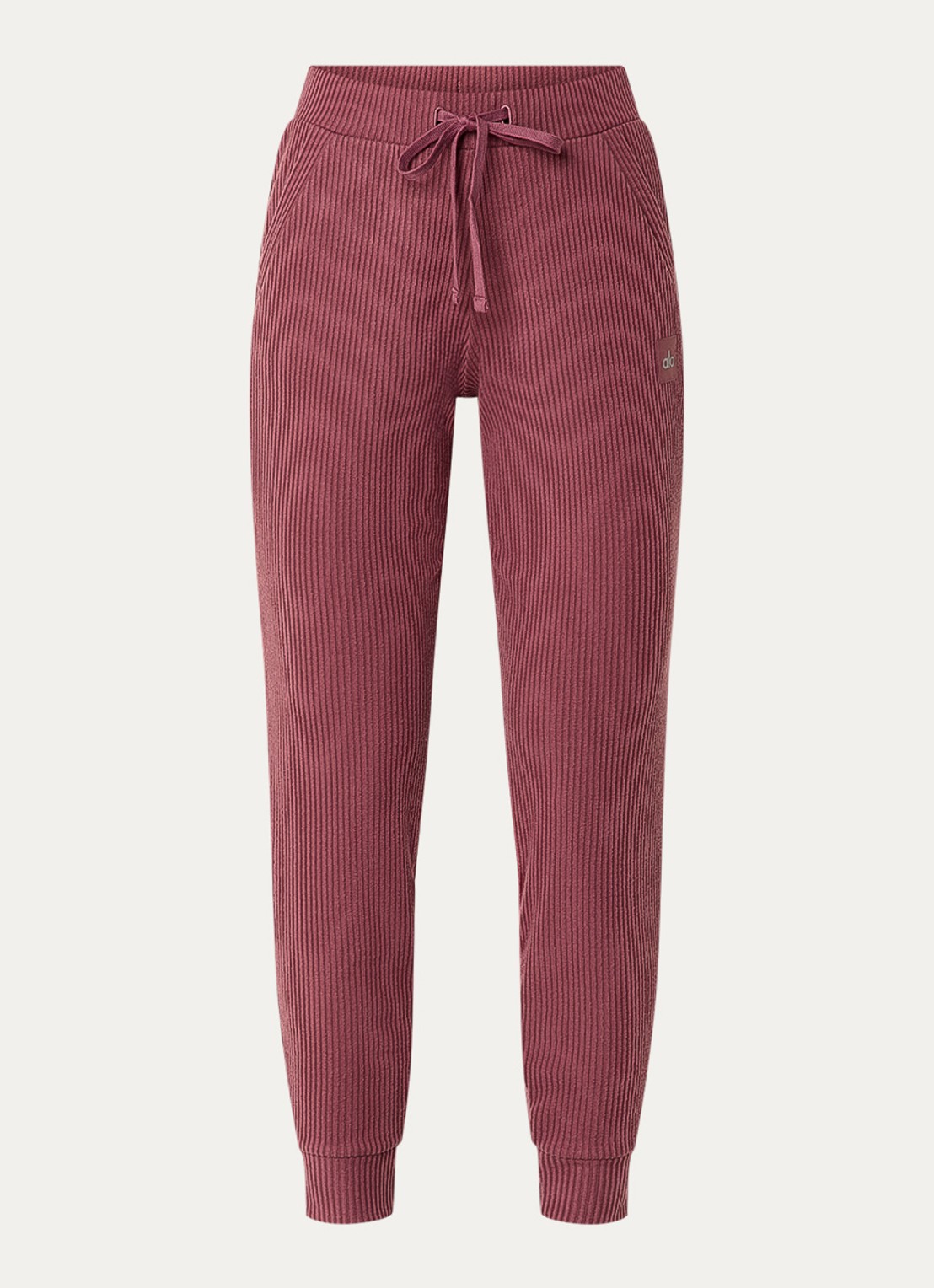 Alo Yoga Muse high waist tapered fit cropped joggingbroek met trekkoord en ribstructuur - voorkant bordeauxrood