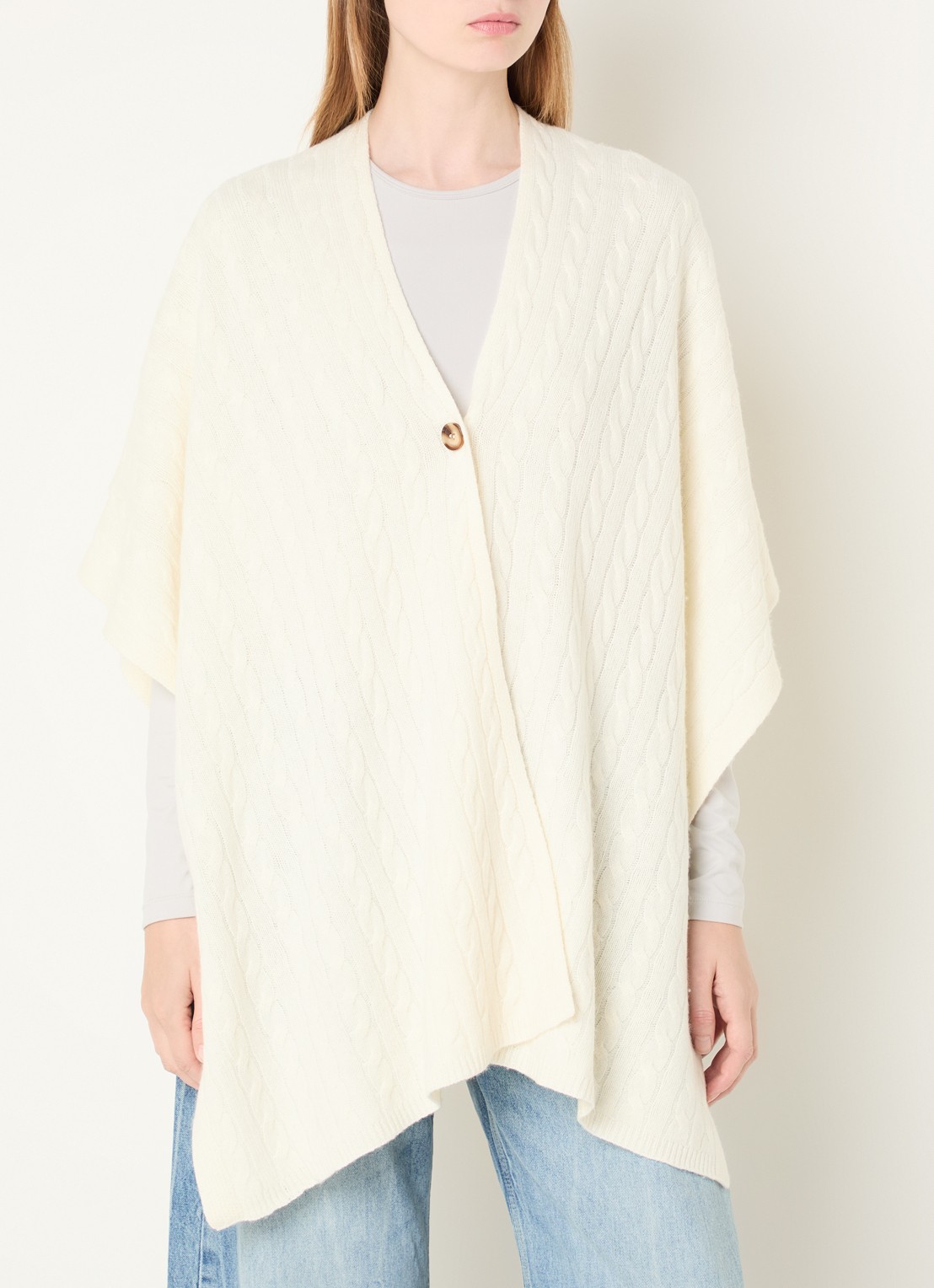Benetton Kabelgebreide cape in kasjmierblend - detail ivoor