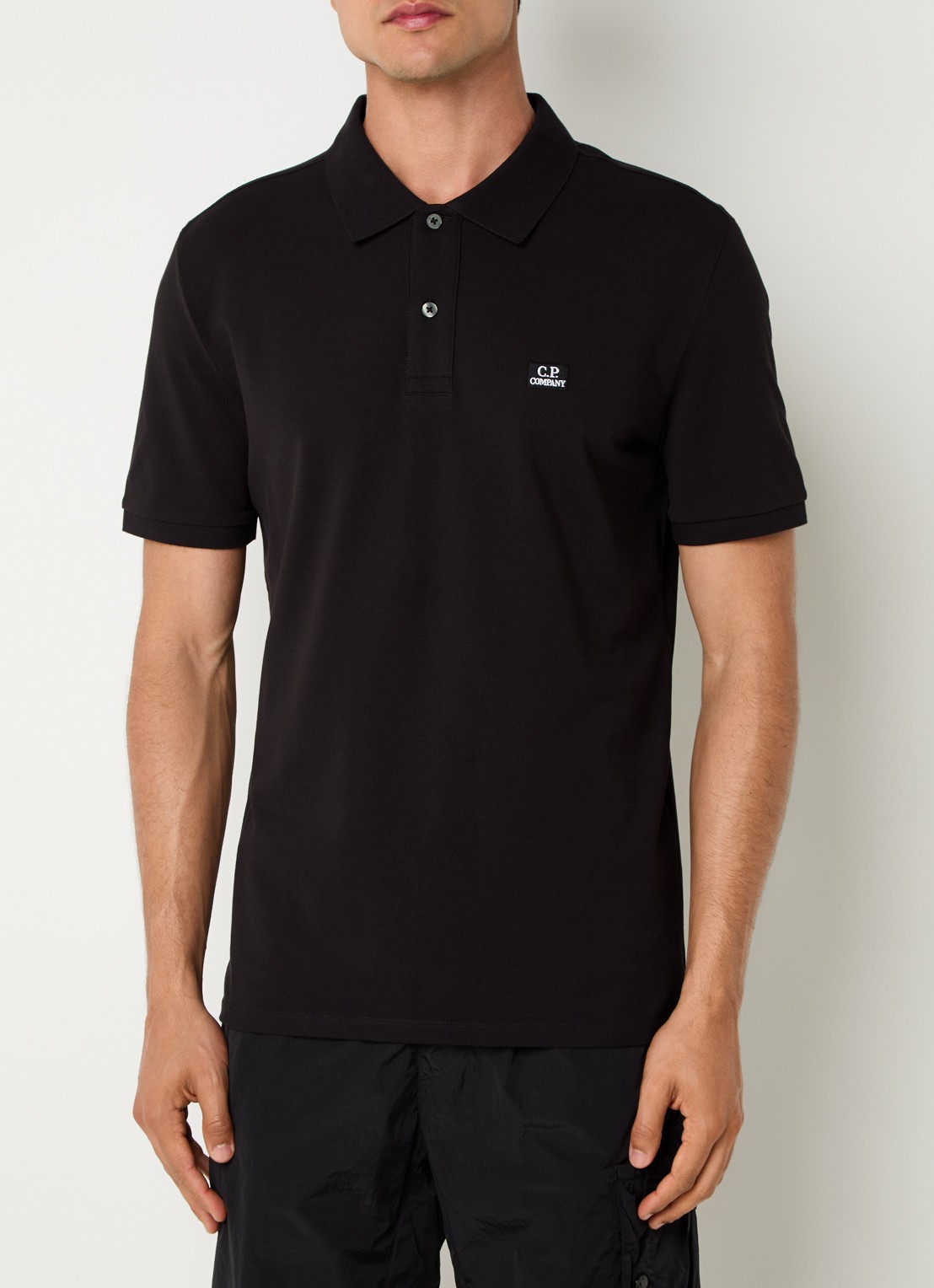 C.P. Company Regular fit polo met logoborduring - detail zwart