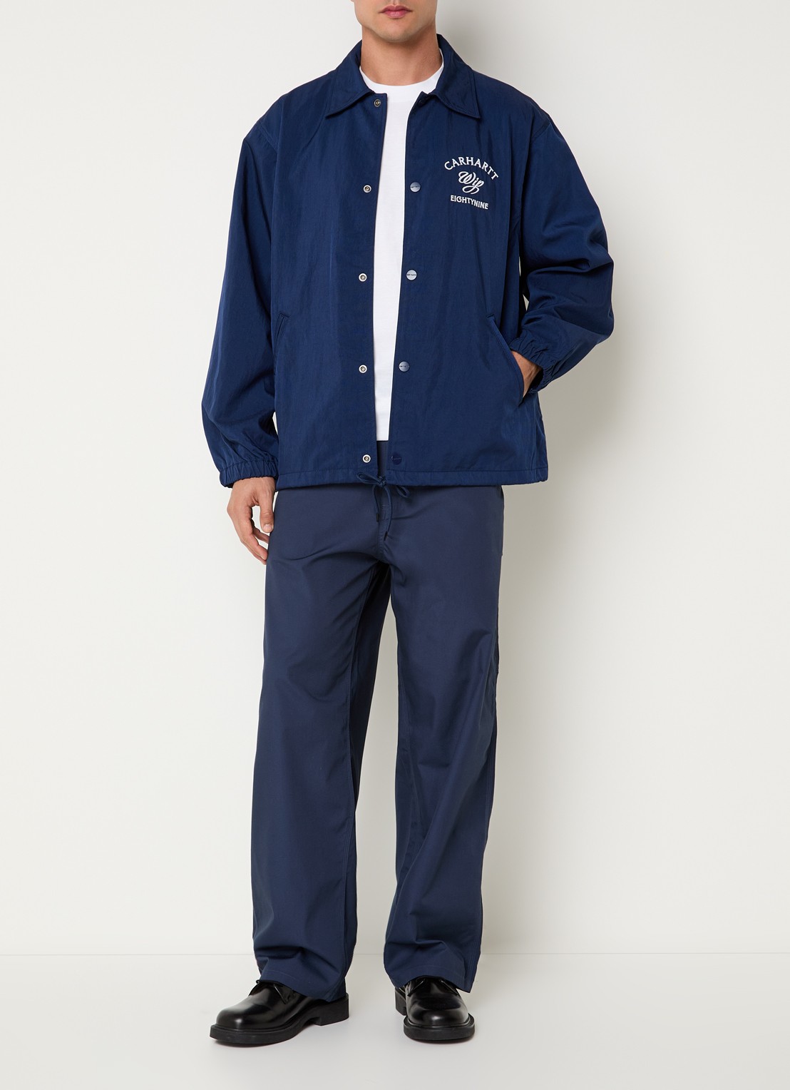 Carhartt WIP Eightynine Coach softshell jack met steekzakken - voorkant 3 indigo