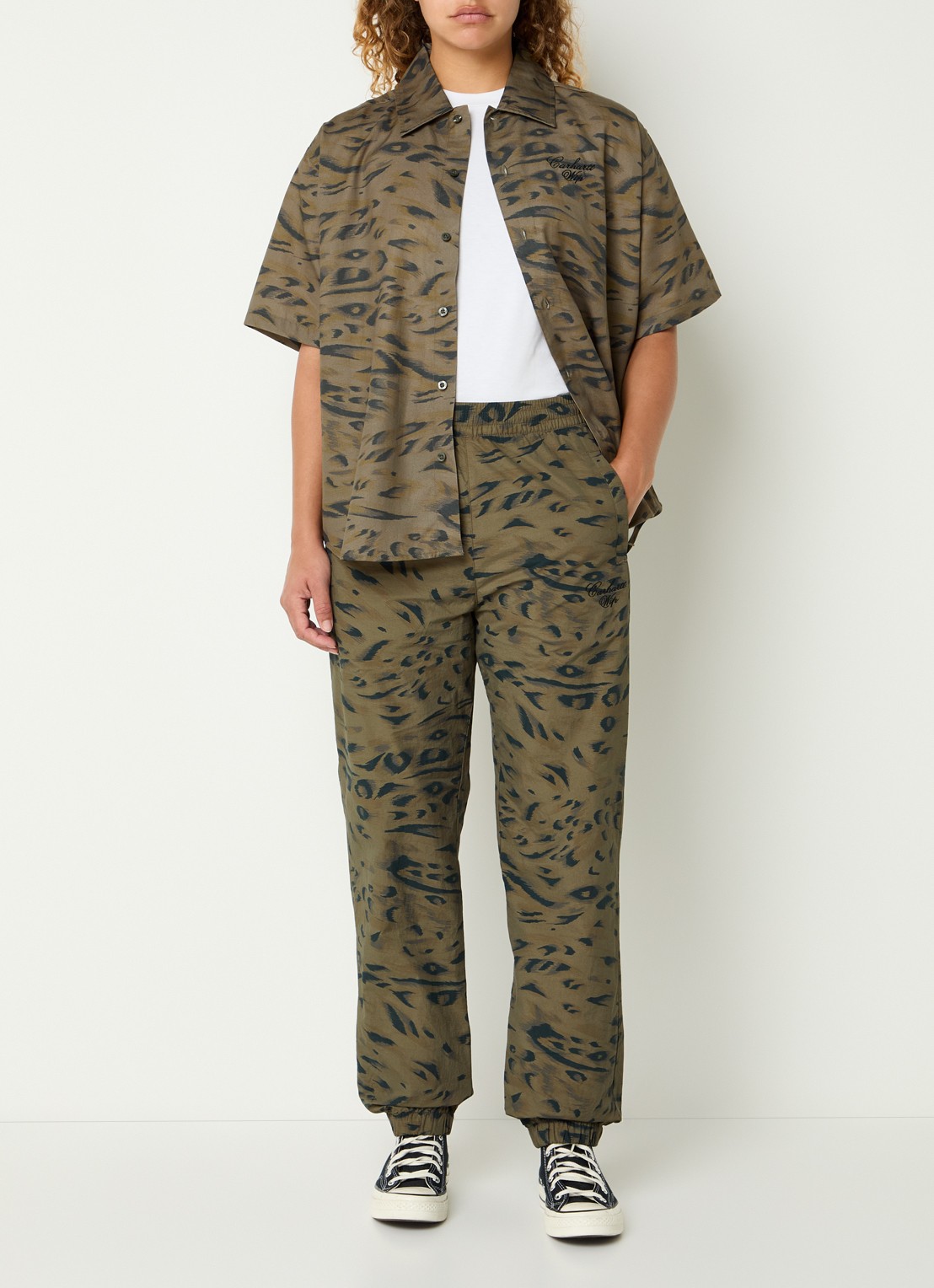 Carhartt WIP High waist tapered fit trackpants met steekzakken - voorkant 2 bronsgroen