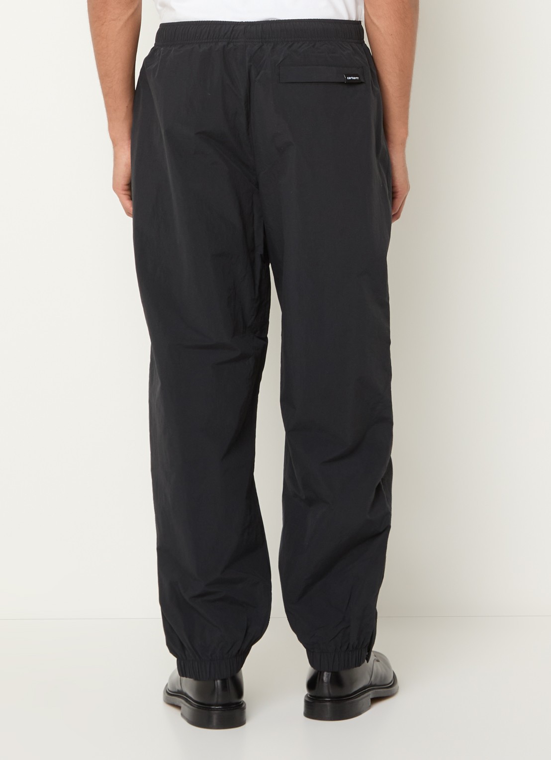 Carhartt WIP Tapered fit trackpants met logo en steekzakken - achterkant zwart