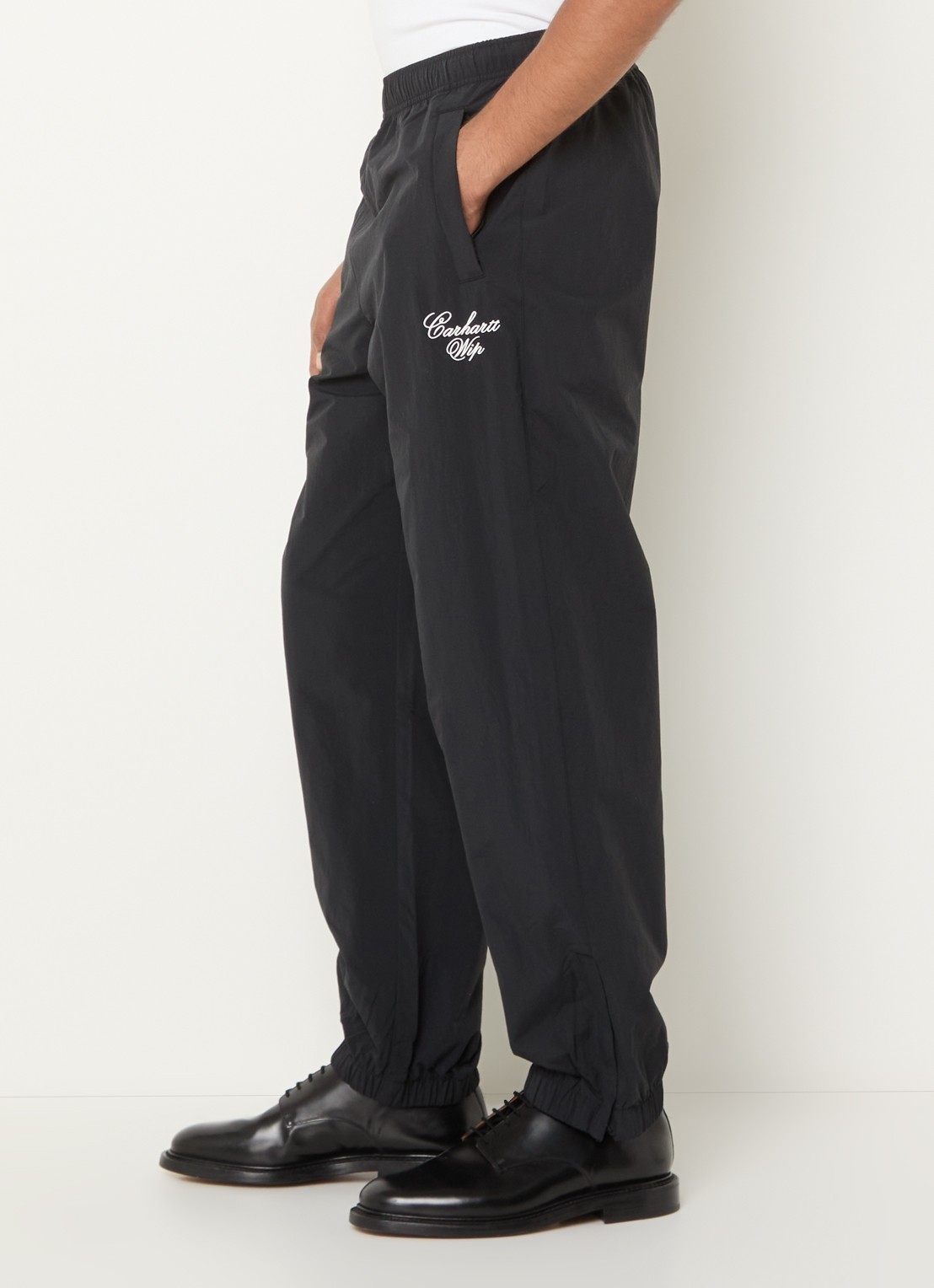 Carhartt WIP Tapered fit trackpants met logo en steekzakken - detail 3 zwart