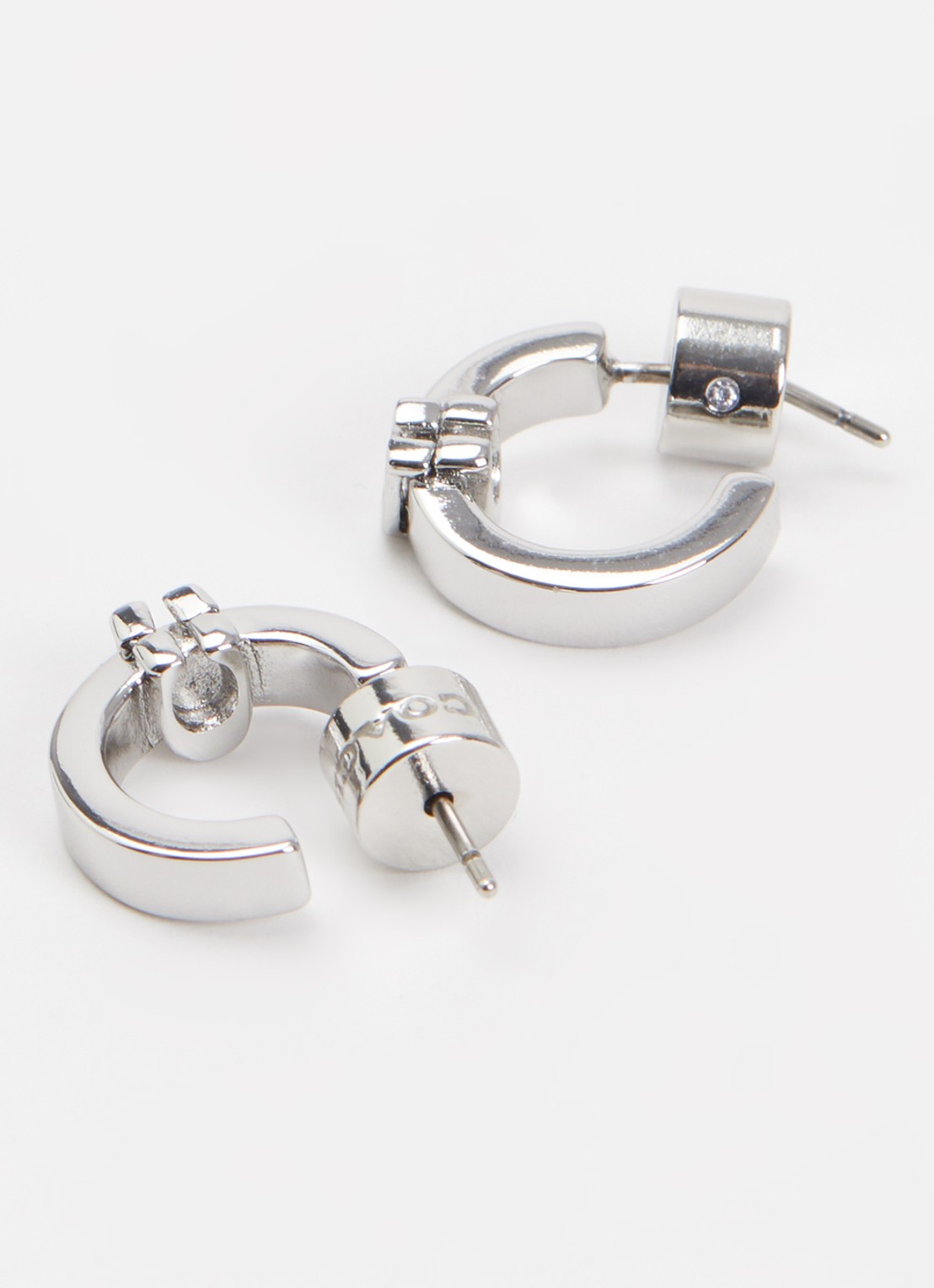 Coach C Huggie oorringen - detail zilver