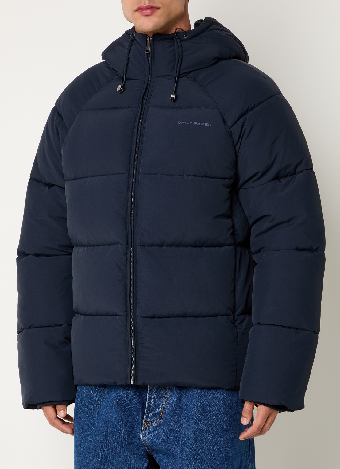 Daily Paper Puffer jack met ritszakken en capuchon - detail donkerblauw