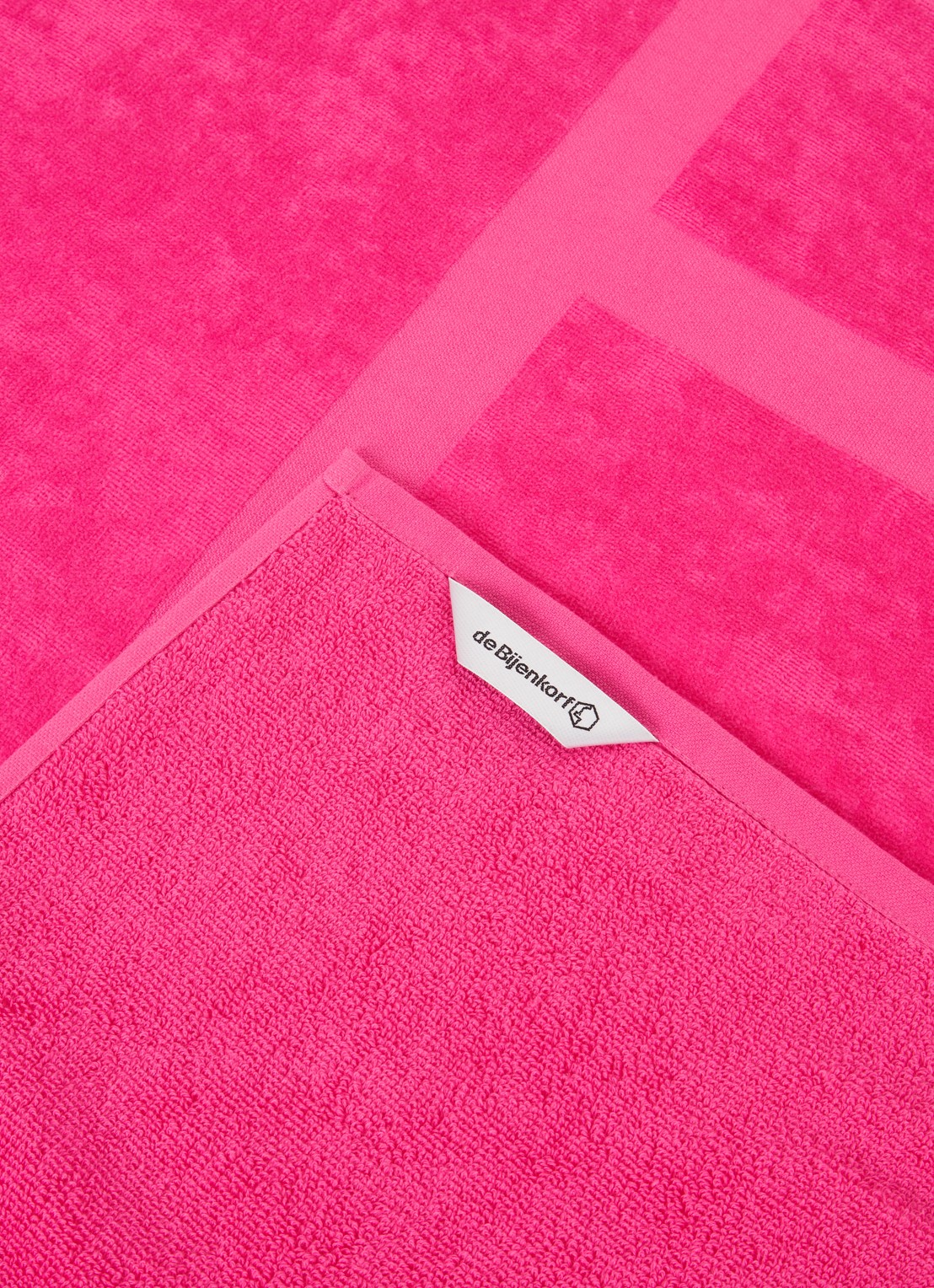 de Bijenkorf Home Soleil strandlaken -  400 gr/m2 - 100 x 180 cm - voorkant 2 fuchsia