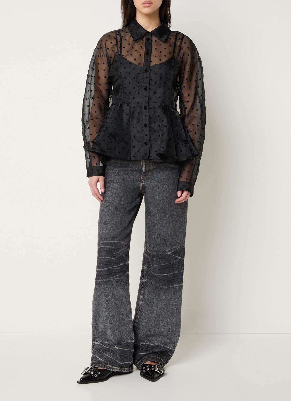 Ganni Semi-transparante blouse met stippenprint en peplum - voorkant 4 zwart