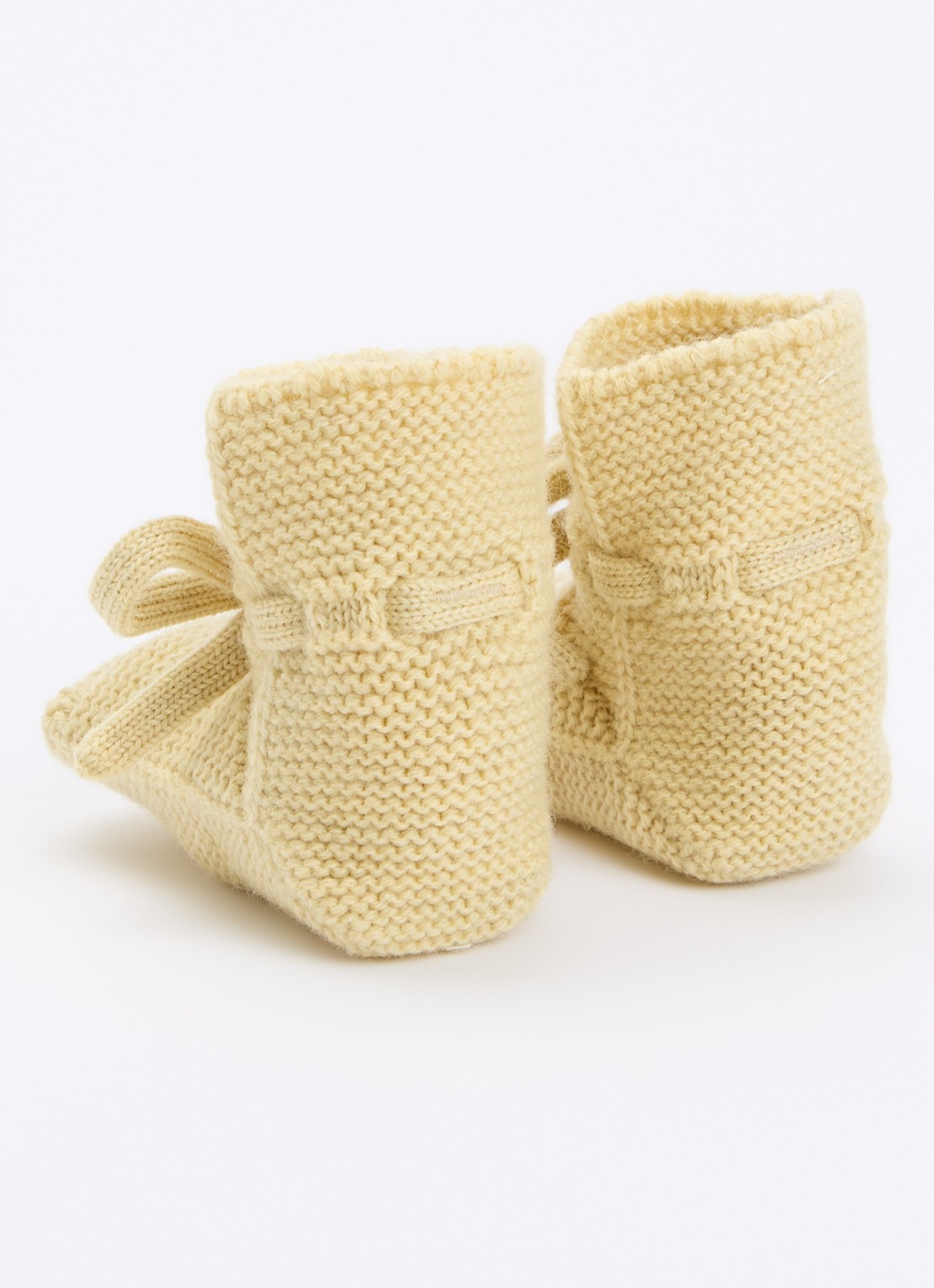 Hvid Babyslofjes van merino wol - achterkant 3 vanillegeel