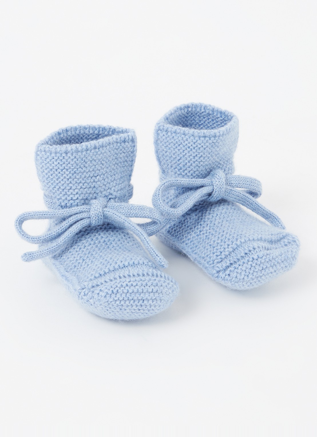 Hvid Babyslofjes van merino wol - voorkant lichtblauw