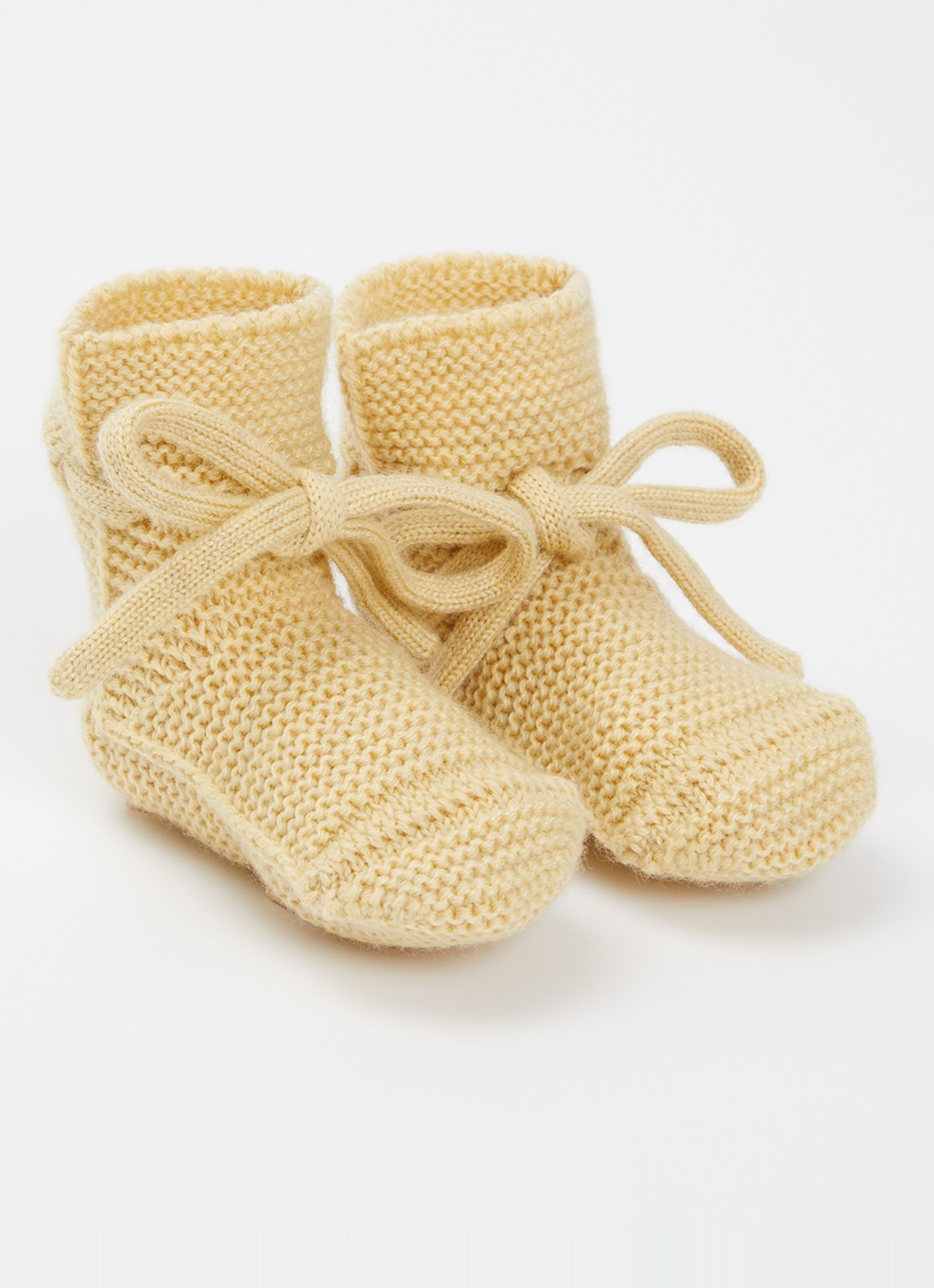 Hvid Babyslofjes van merino wol - voorkant lichtgeel