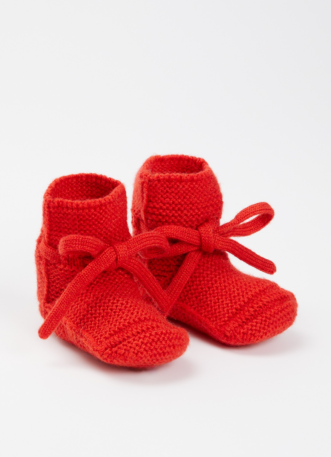 Hvid Babyslofjes van merino wol - voorkant 2 rood