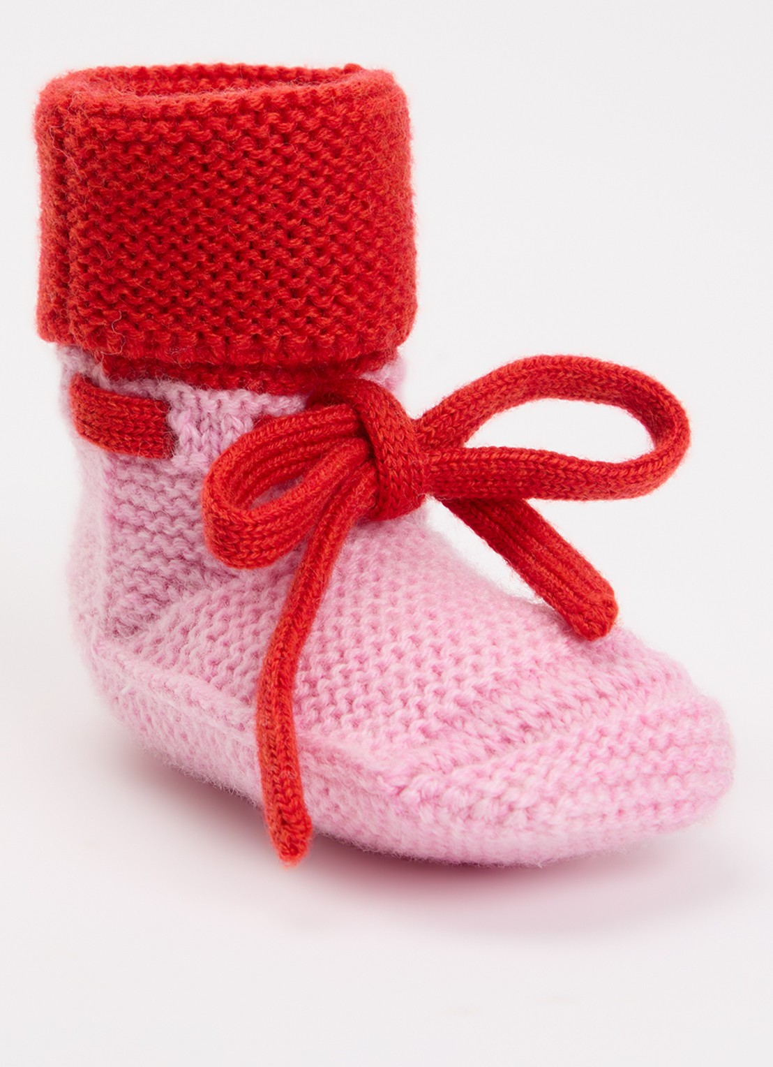 Hvid Babyslofjes van merino wol  - voorkant roze