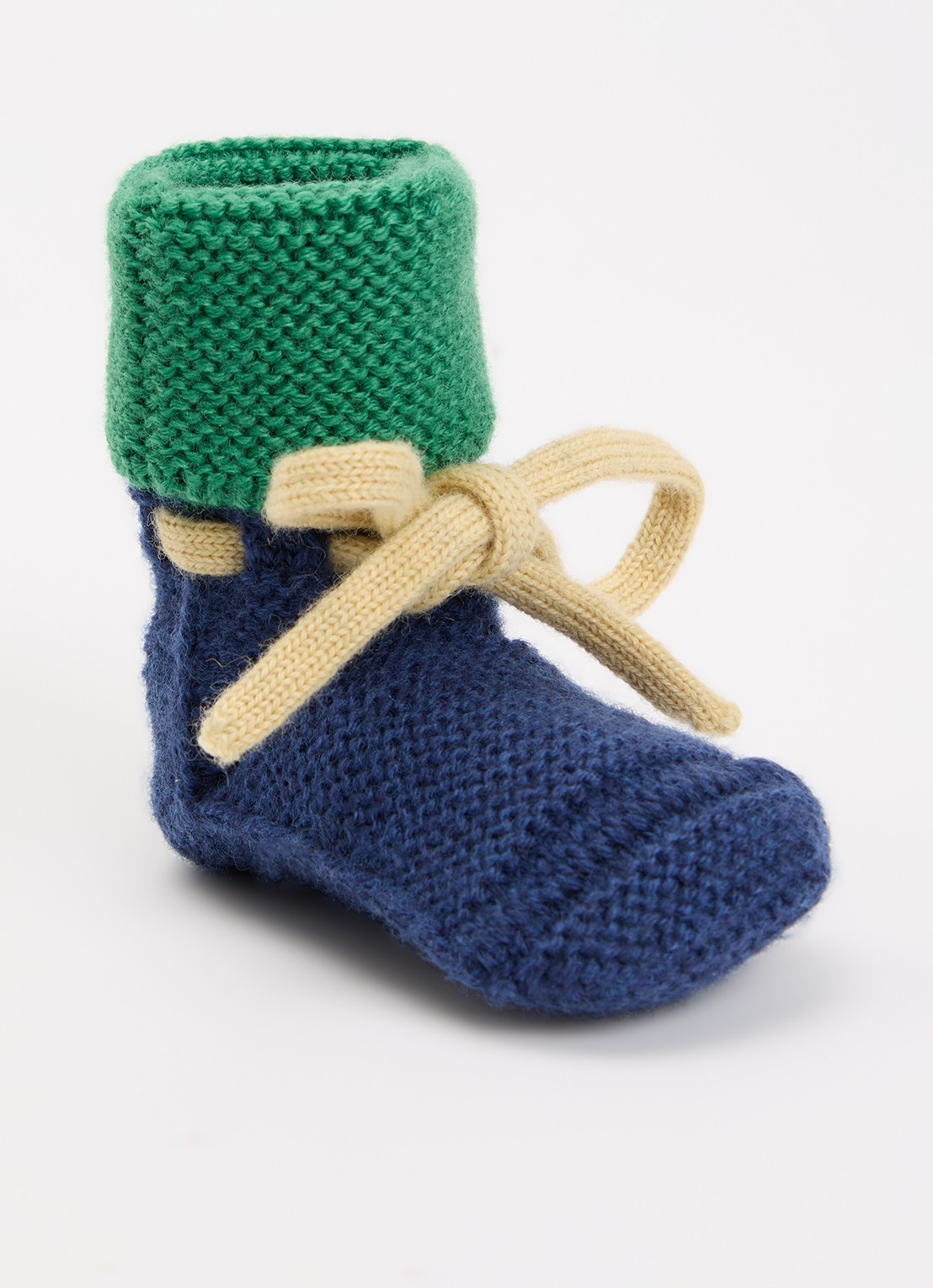 Hvid Babyslofjes van merino wol  - voorkant donkerblauw