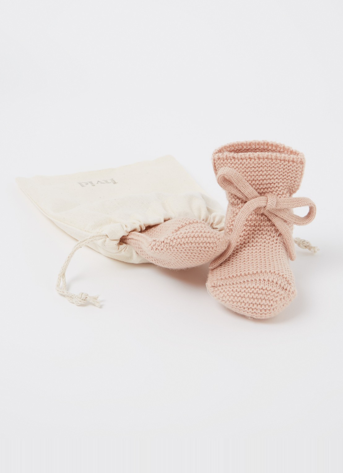 Hvid Booties gebreide babyslofjes van wol - detail zalmroze