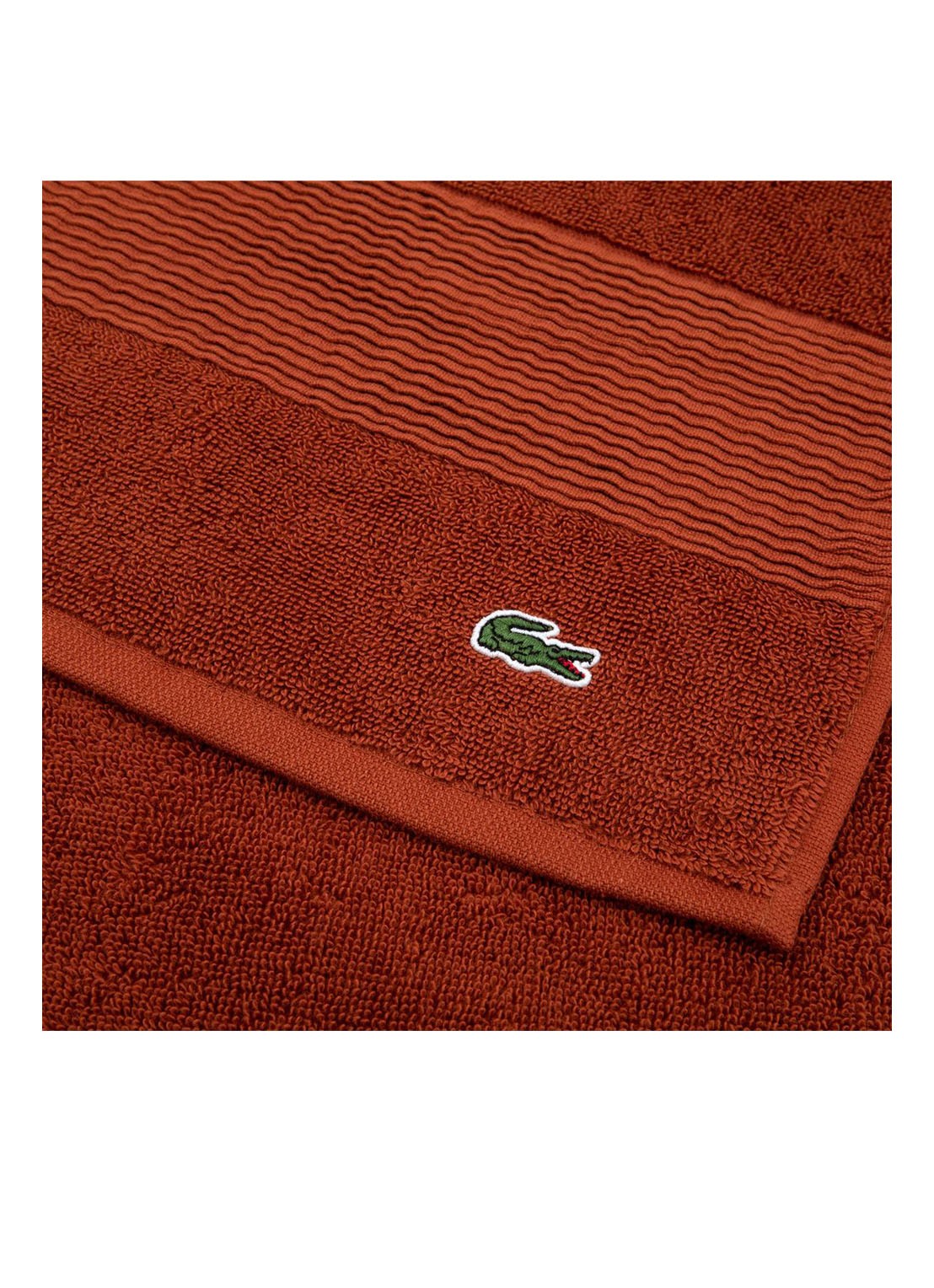 Lacoste L Lecroco gastendoek - 600 gr/m2 - 60 x 40 cm - detail donkeroranje