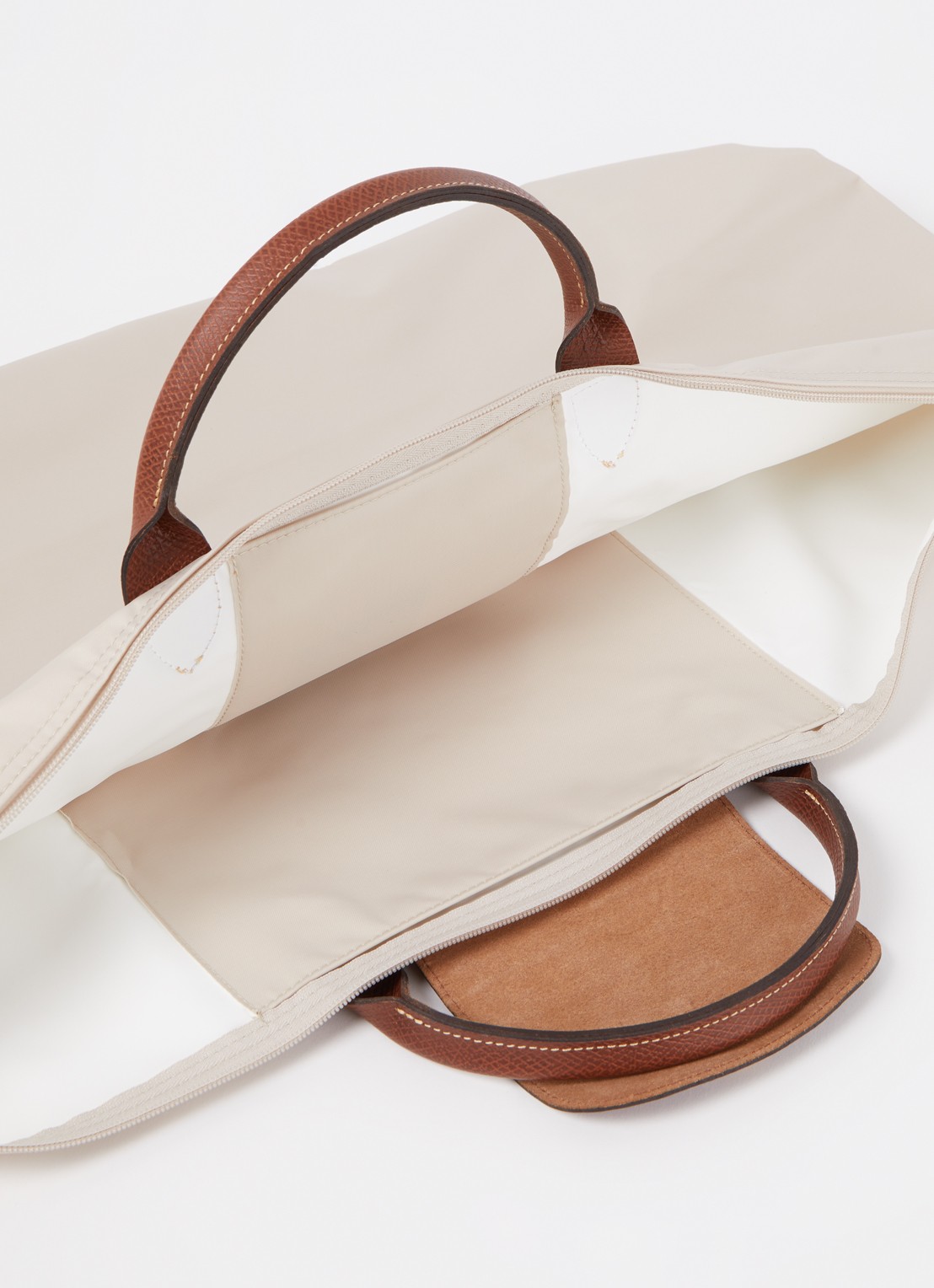 Longchamp Le Pliage reistas XL met leren details - detail creme
