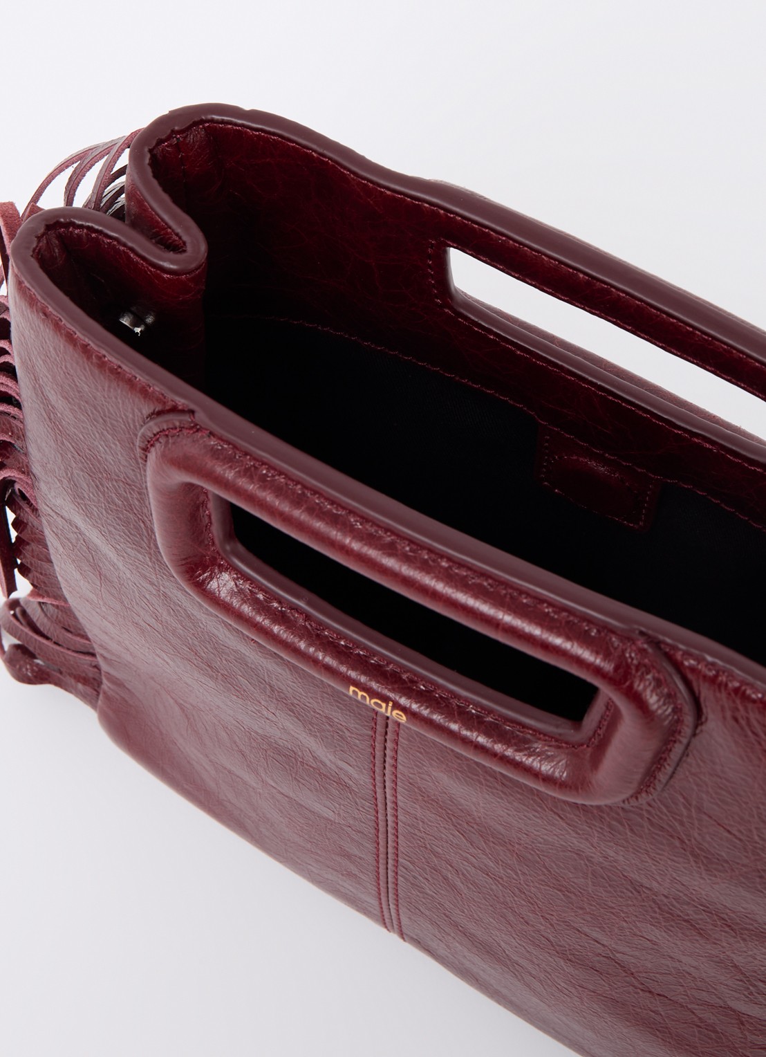 Maje M bag crossbodytas van leer met franjes - detail 2 bordeauxrood