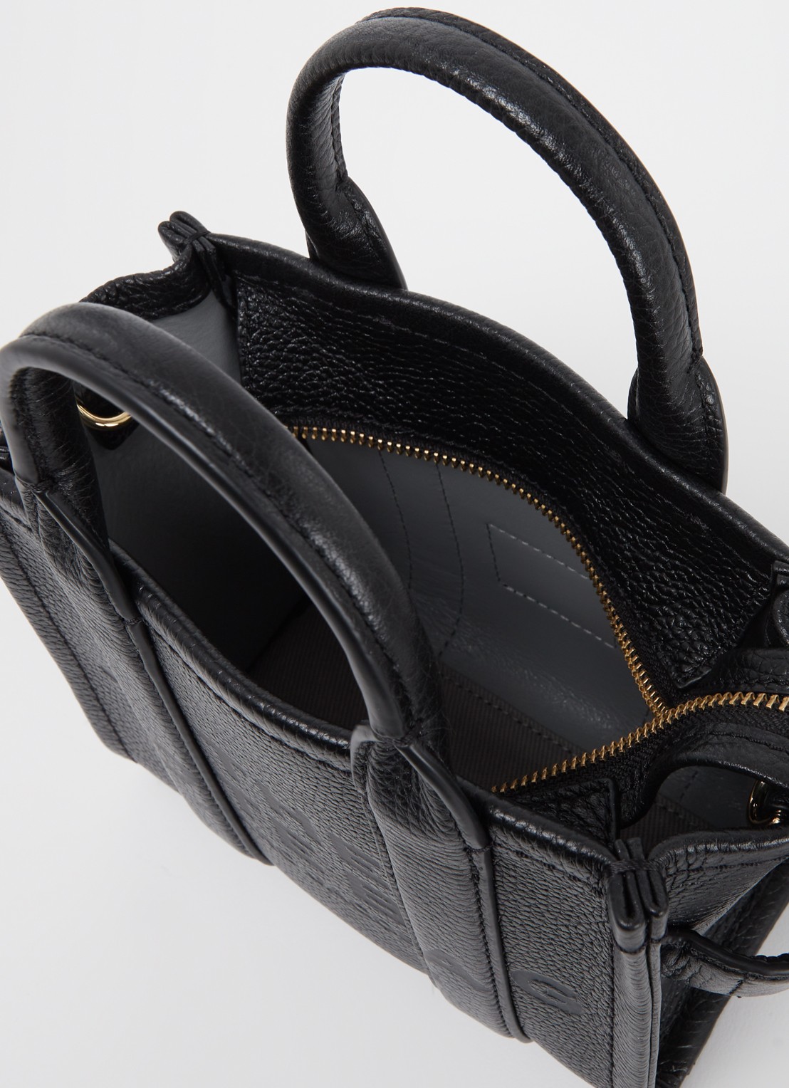 Marc Jacobs The Crossbody Tote handtas van leer - detail zwart