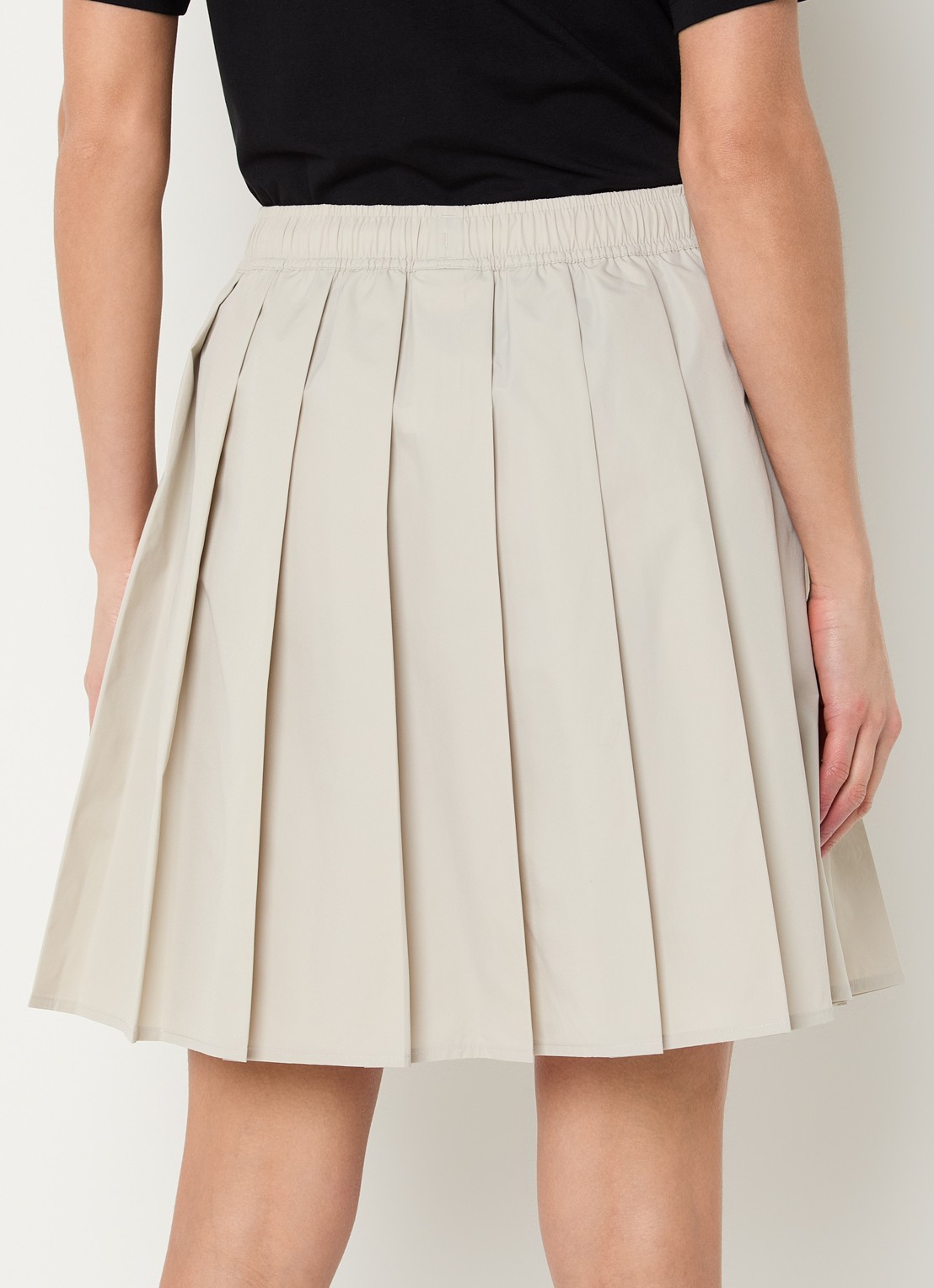 New Balance Mini rok met plooien en steekzakken - achterkant beige