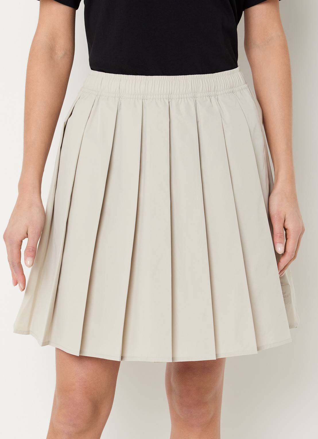 New Balance Mini rok met plooien en steekzakken - detail 2 beige