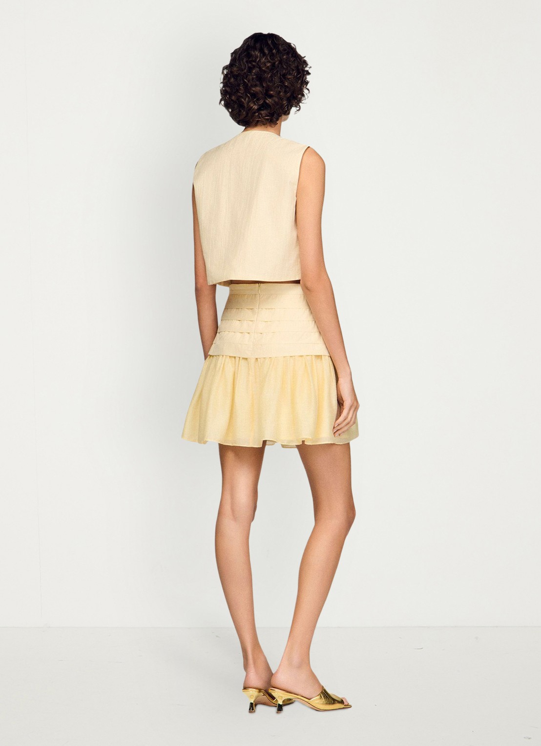 Sandro Mini rok met plooien - achterkant vanilla / geel