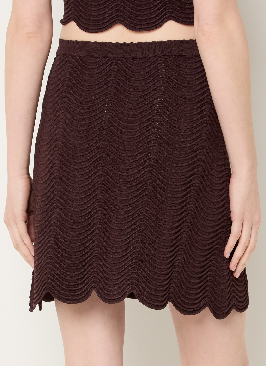 Sandro Mini rok met sierknopen - achterkant donkerbruin