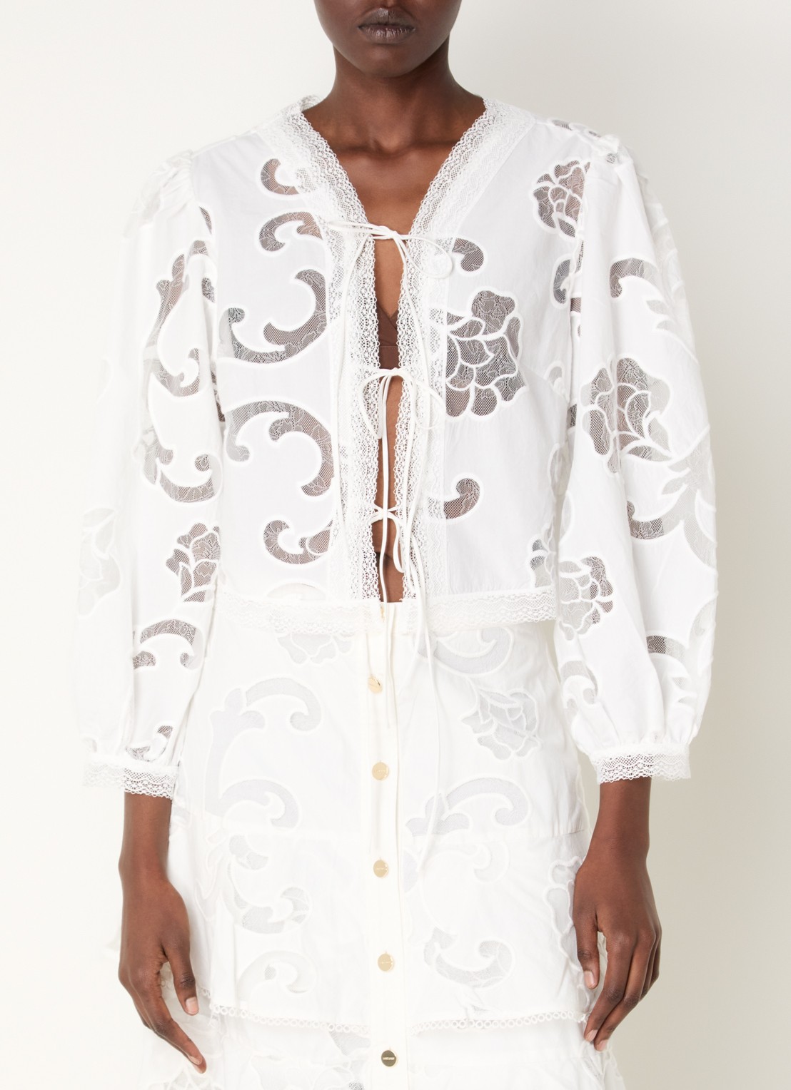 Sandro Semi-transparante top met broderie - detail wit