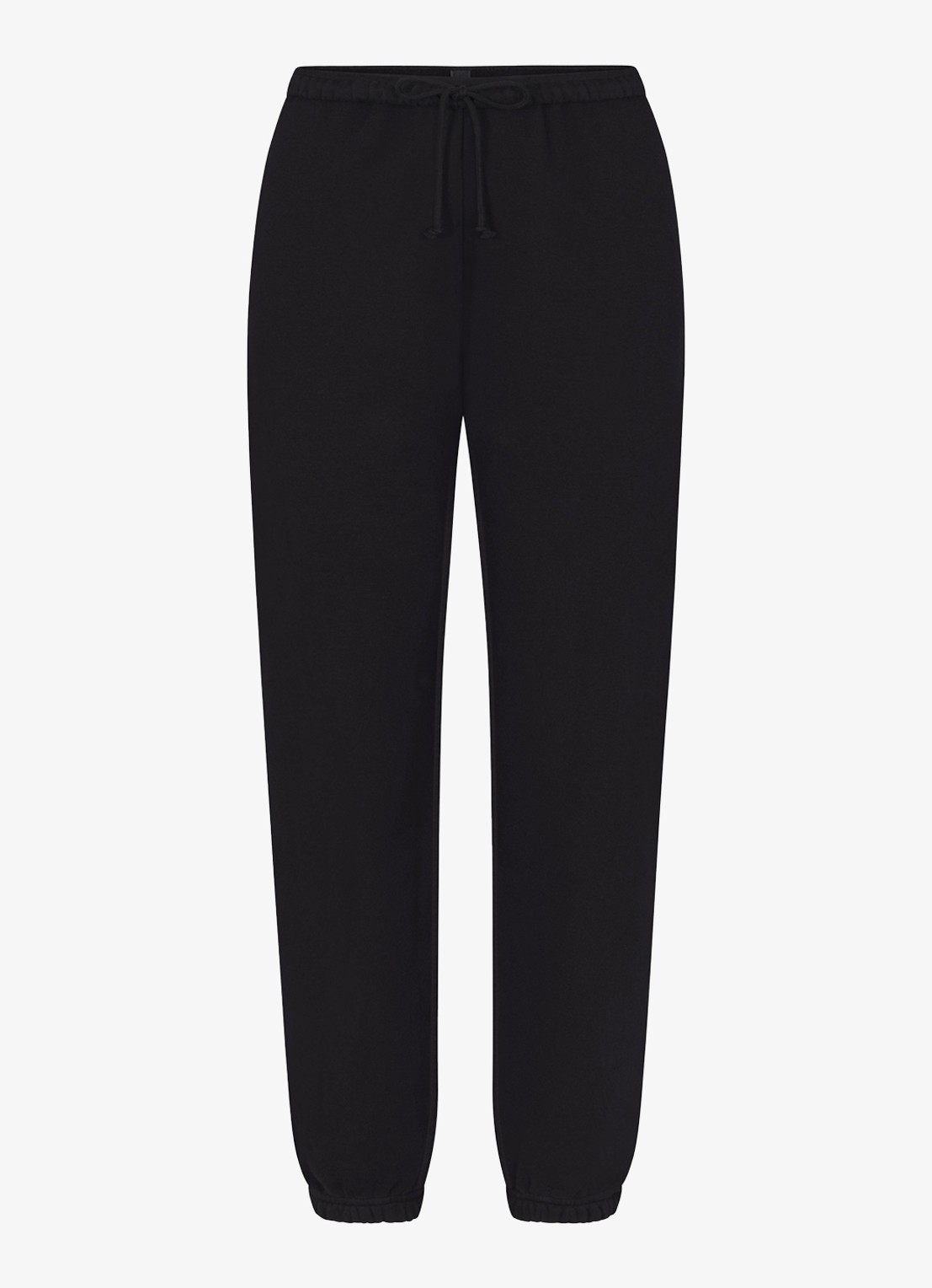 SKIMS Cotton Fleece mid waist tapered fit loungebroek met steekzakken - voorkant zwart