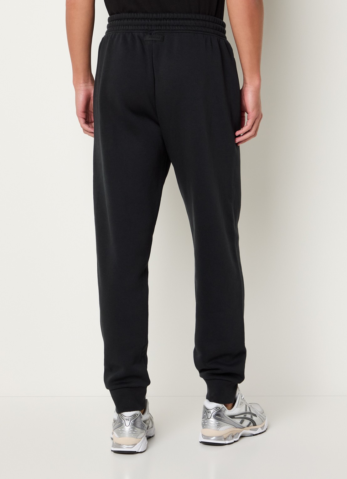 SKIMS Tapered fit joggingbroek met steekzakken - achterkant 9 washed onyx