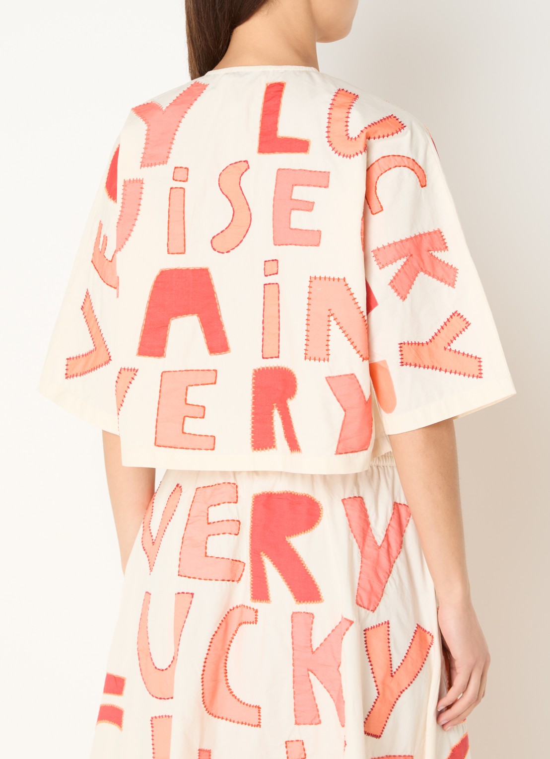 Stella Nova Cruise cropped blouse met borduring - achterkant oranjerood