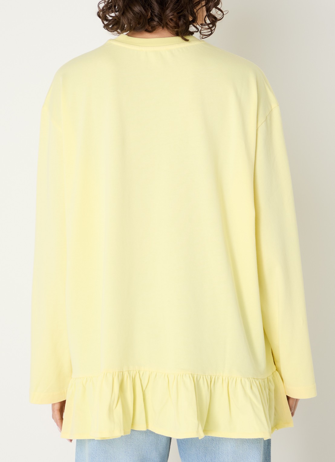 Stieglitz Brisa longsleeve met logo en volant - achterkant geel