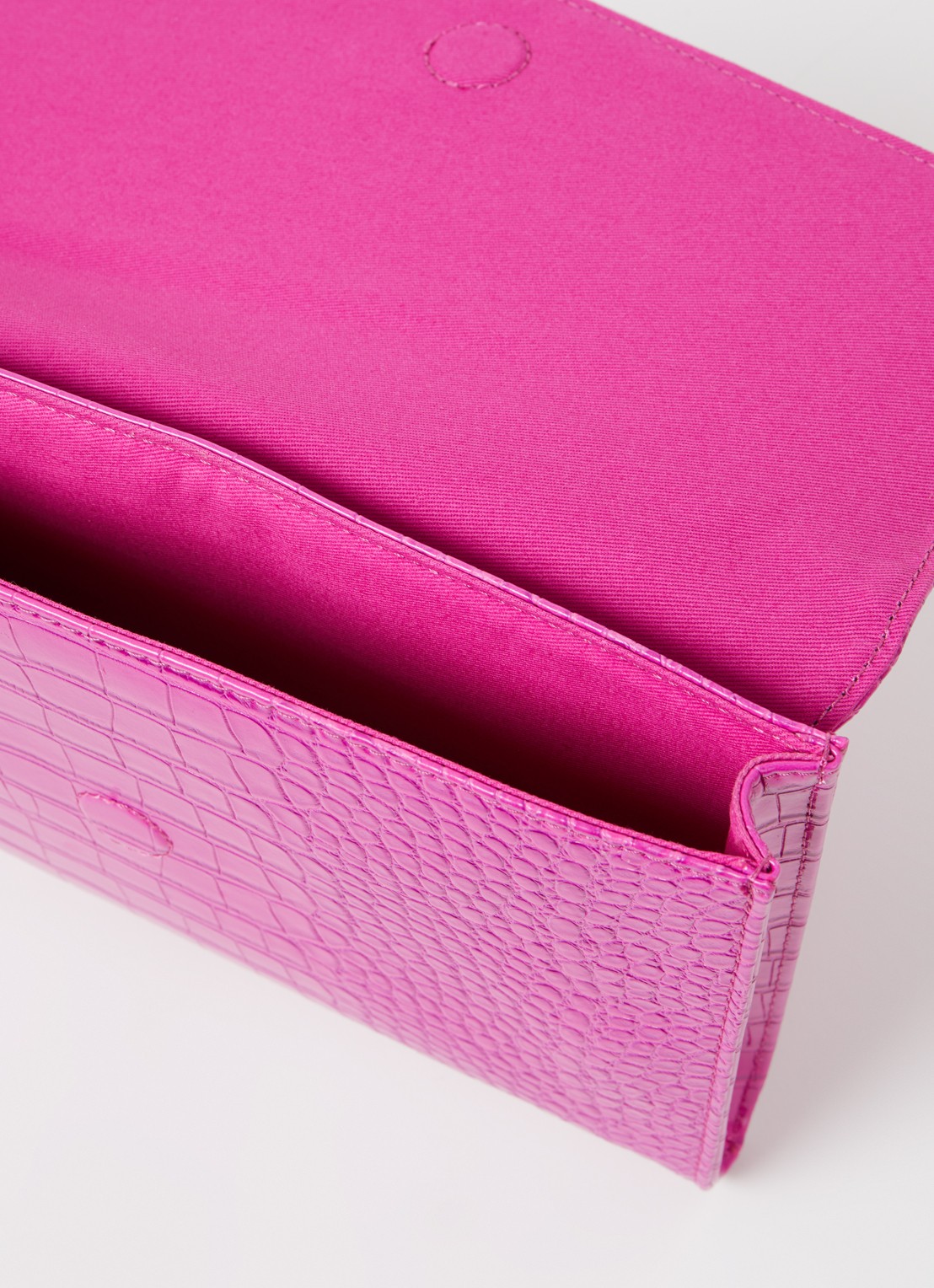 Ted Baker Crocey clutch met crocostructuur - detail fuchsia