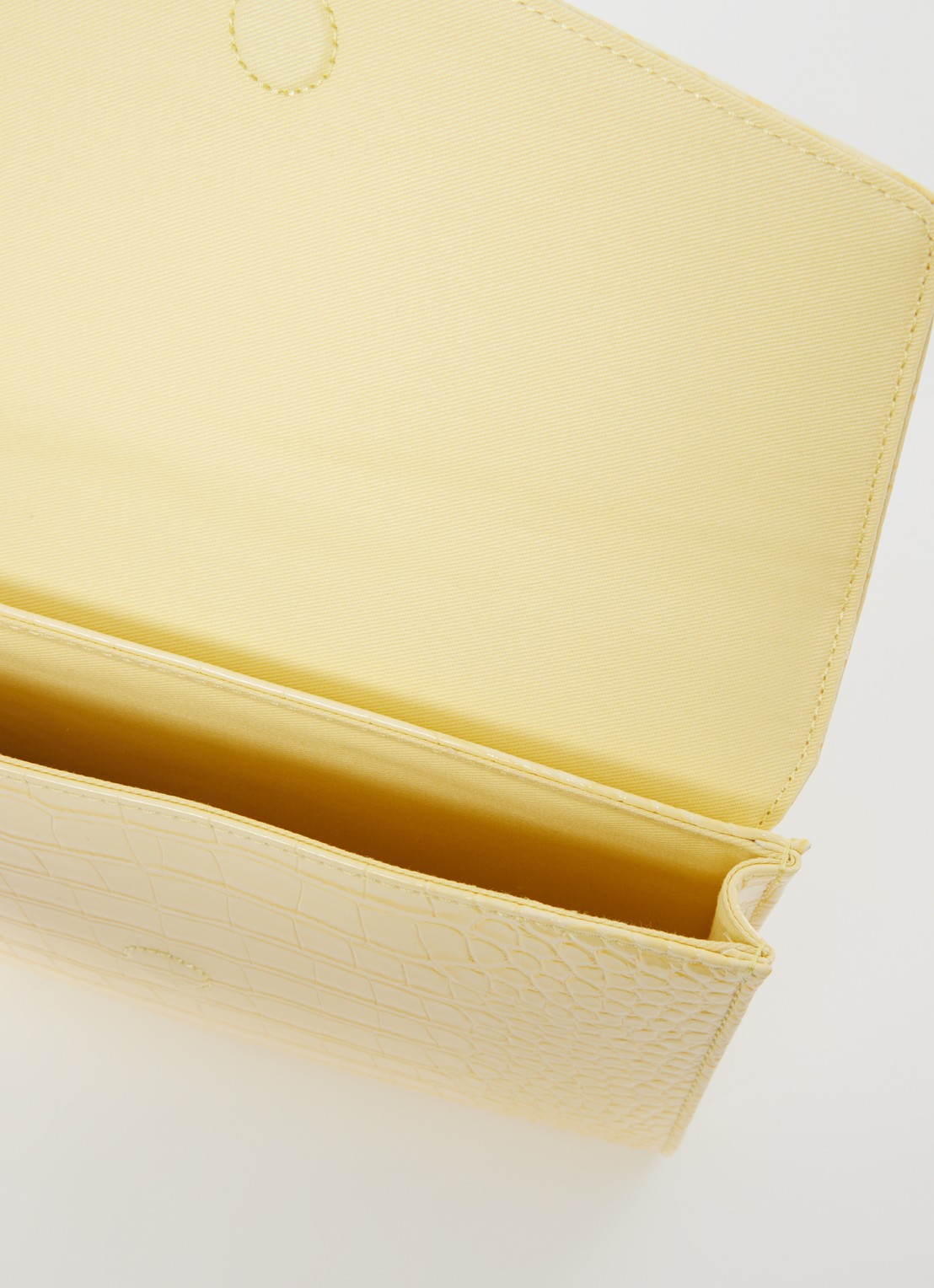 Ted Baker Crocey clutch met crocostructuur - detail 3 lichtgeel