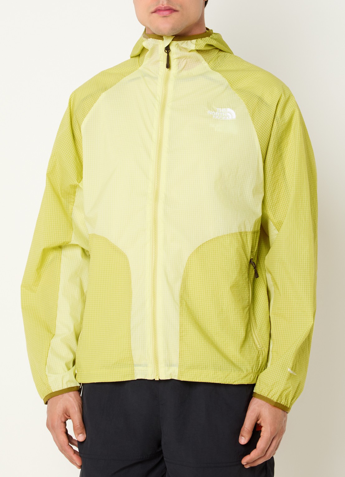 The North Face Windjack met capuchon en ritszakken - detail lichtgroen