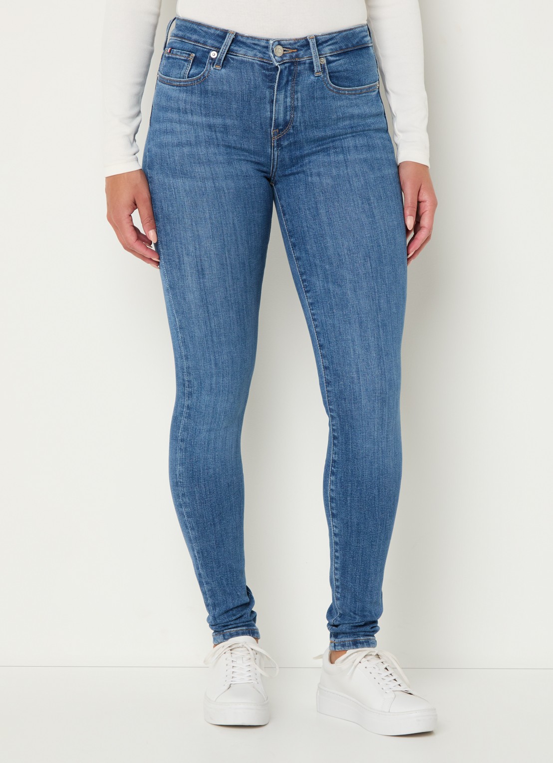 Tommy Hilfiger Como mid waist skinny jeans met medium wassing - detail indigo