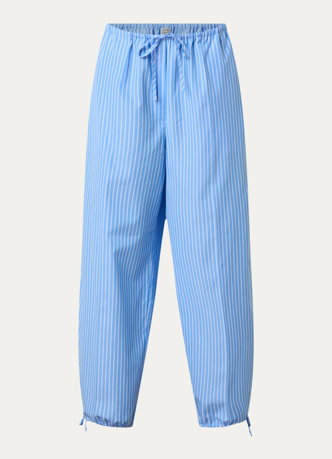 TOTEME High waist tapered fit broek met streepprint en gestrikt detail - voorkant lichtblauw