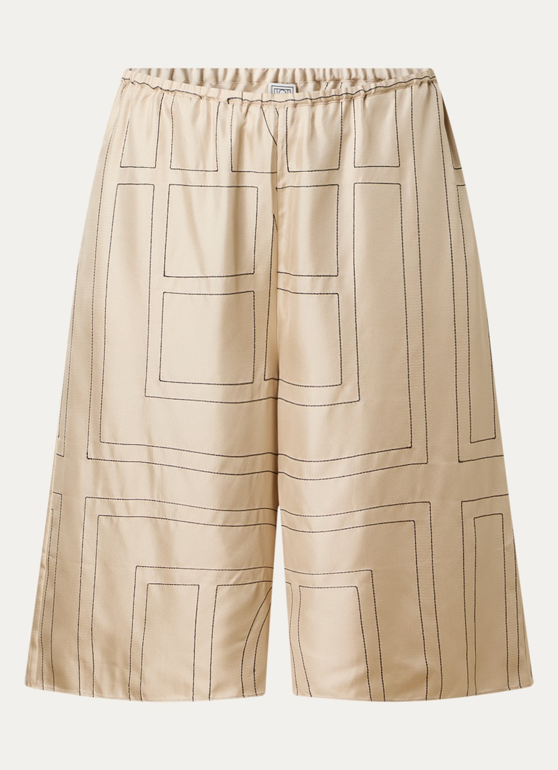 TOTEME Low waist wide fit culotte van zijde met logoprint borduring - voorkant vanillegeel