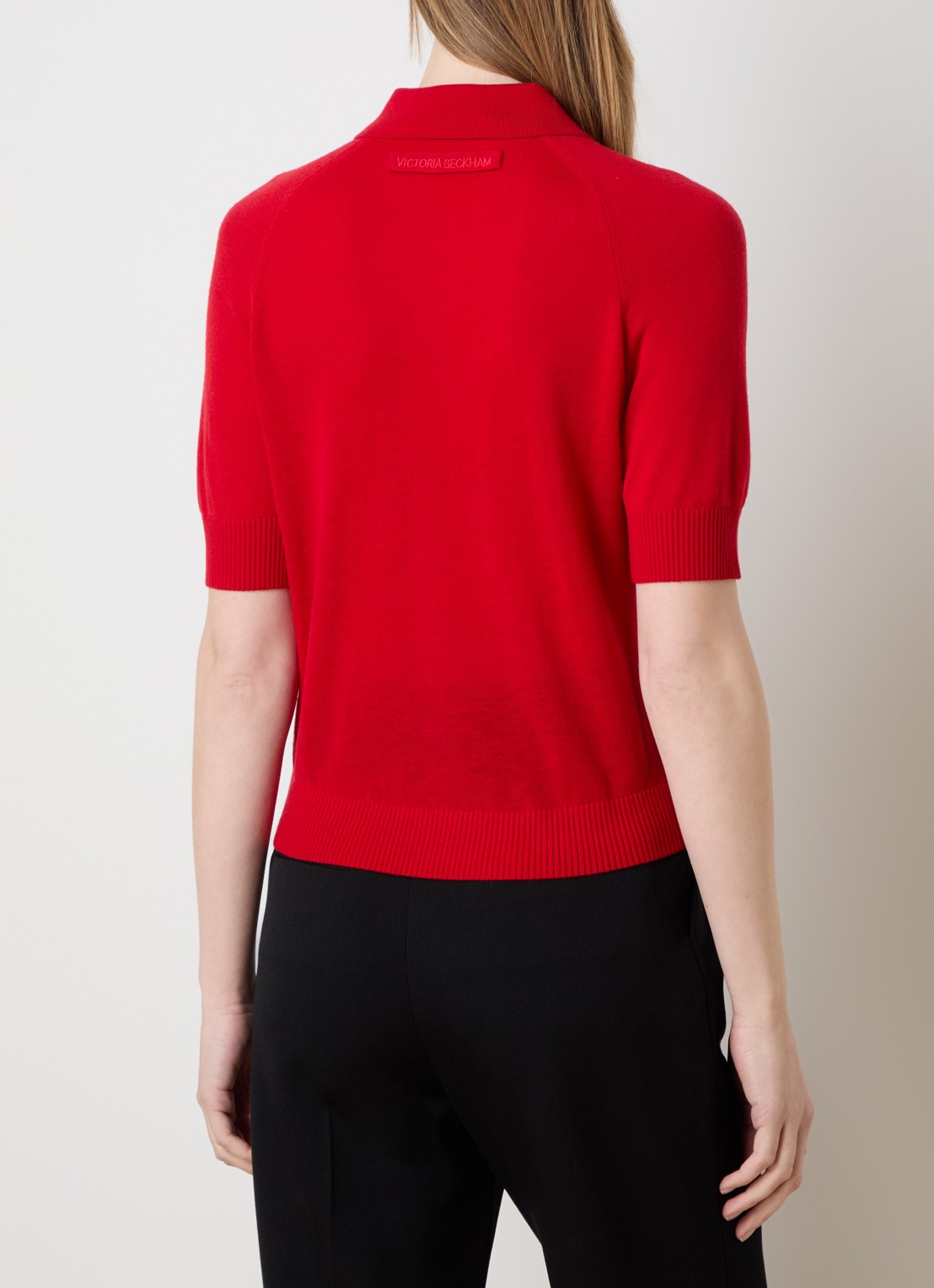 Victoria Beckham Fijngebreide top van wol met polokraag - achterkant rood