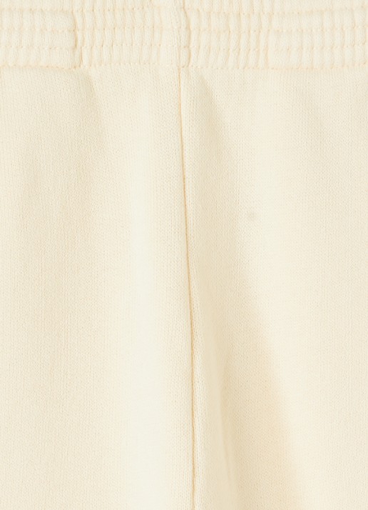 American Vintage Izubird tapered fit joggingbroek met logo - detail lichtgeel