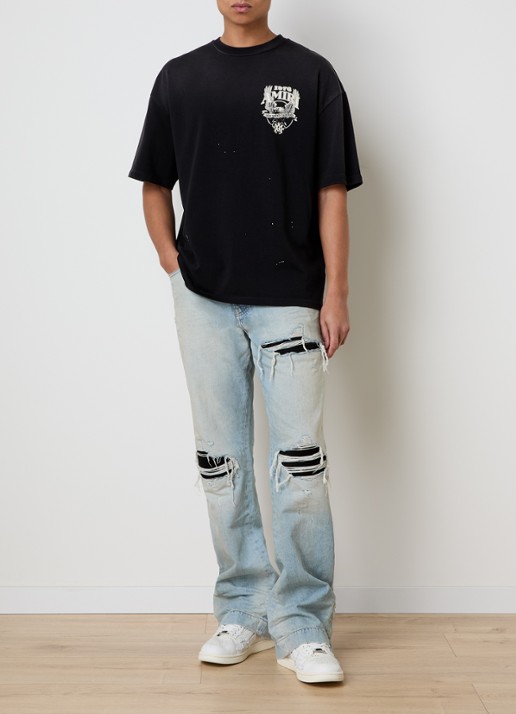 AMIRI MX1 loose fit jeans met destroyed afwerking - voorkant 2 lichtblauw