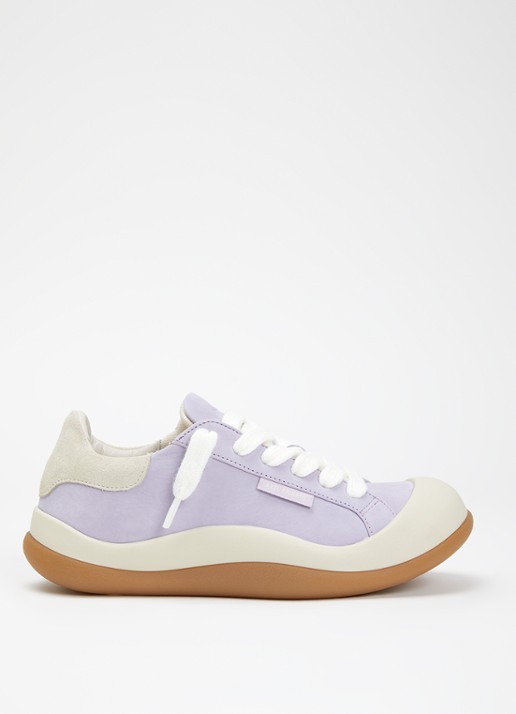 Axel Arigato Squish sneaker van nubuck met suède details
