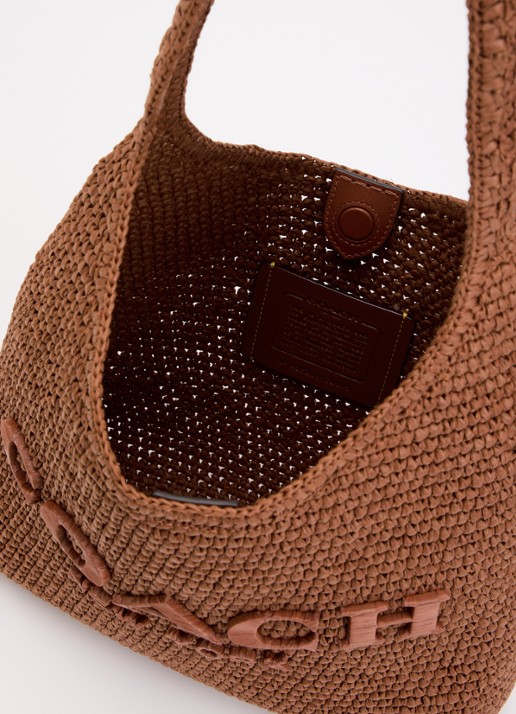 Coach Brooklyn 29 schoudertas van stro met logo  - detail steenrood