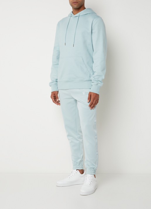 Daily Paper Etape tapered fit cropped trackpants met ritszakken en logoband - voorkant 2 mint