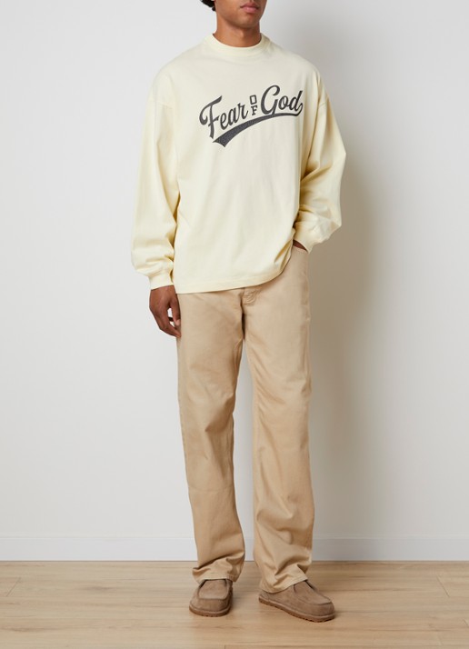 Fear of God Essentials Longsleeve met front- en backprint - voorkant 2 lichtgeel