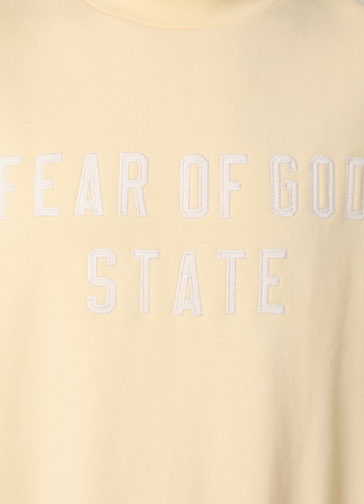 Fear of God Essentials Sweater met logoborduring - detail 2 lichtgeel